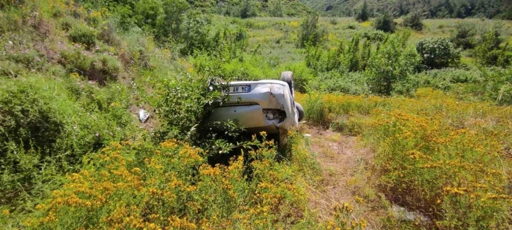 Takla atan otomobilden burnu bile kanamadan kurtuldu
