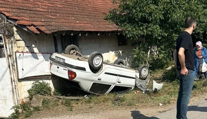 Takla atan otomobilden yaralı kurtuldular